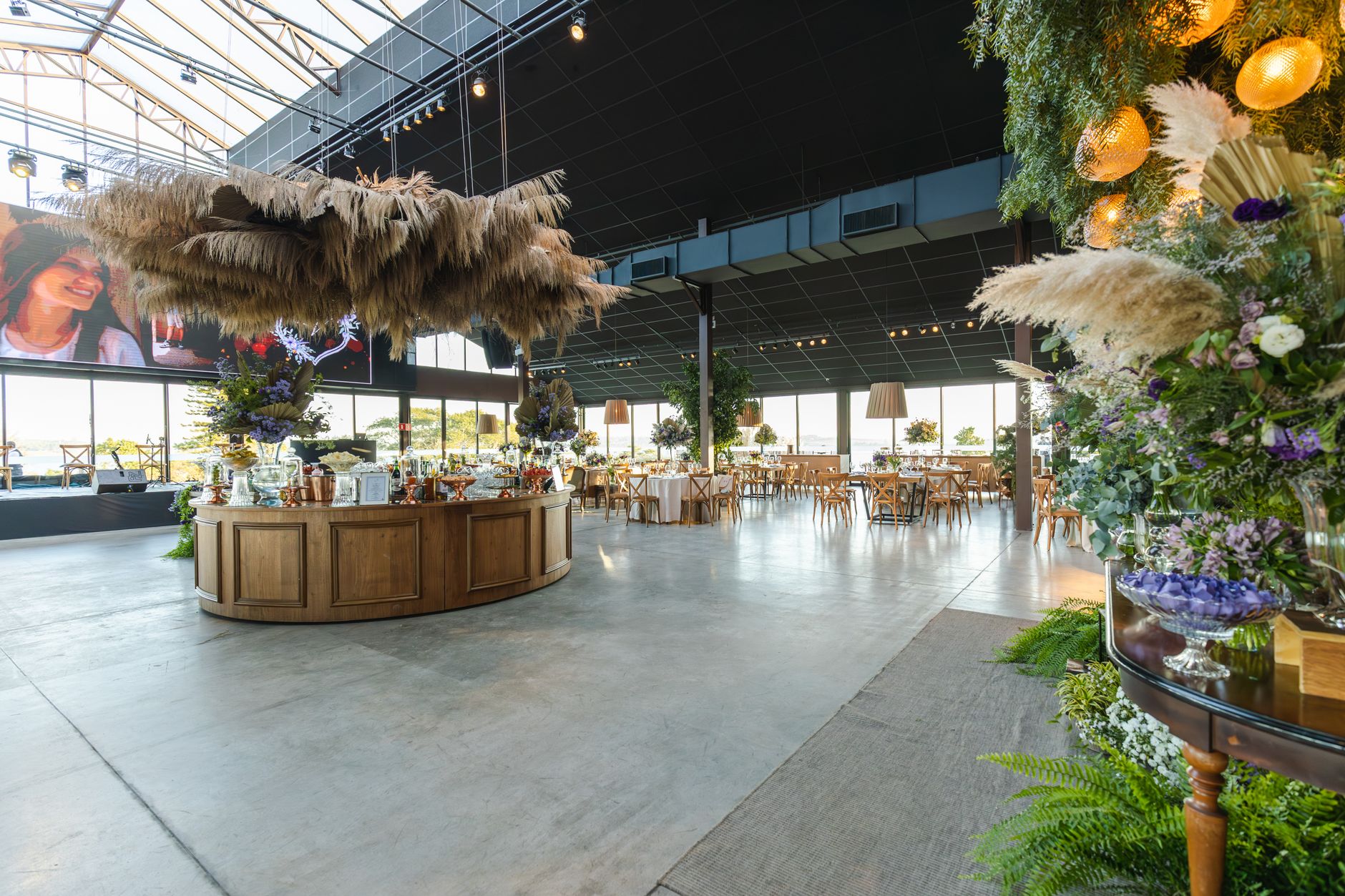 Stylish indoor wedding venue with rustic decor and floral elegance, perfect for a spacious celebration. — Bathroom Wall Panel